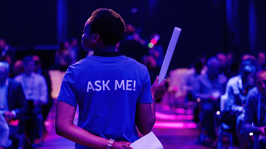 Woman wearing "ask me" t-shirt